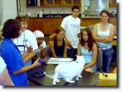 Students with a cat on the table